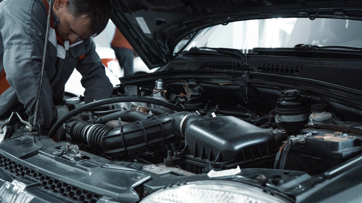 Technicians inspecting vehicle for warranty claim